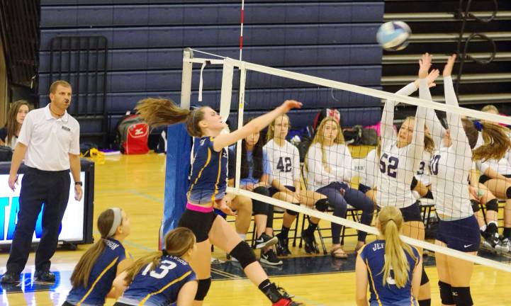 Sparta defeats Jefferson, 2-0, in volleyball At the left Jefferson's Kyra Conville hits the ball towards the Sparta side of the net.