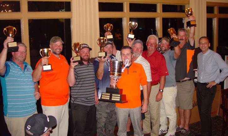 The 19th Ballyowen Golf Team display their trophies with Art Walton, VP of Golf Operations