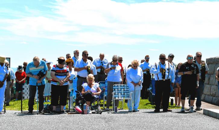 Photos: High Point Veterans Memorial Service <b>Those attending the service bow their heads.</b>
