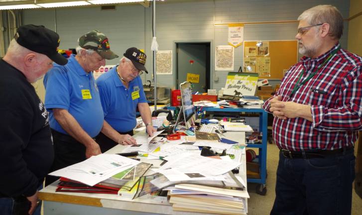Sussex Tech teacher Steven Styles gave the veterans a tour of the design and printing class and taught them about how the colors used in a logo can make a big difference.