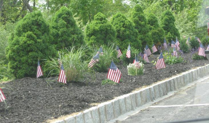 The Bayer Corporation planted beautiful shrubs, ferns and flowers at the cemetery.