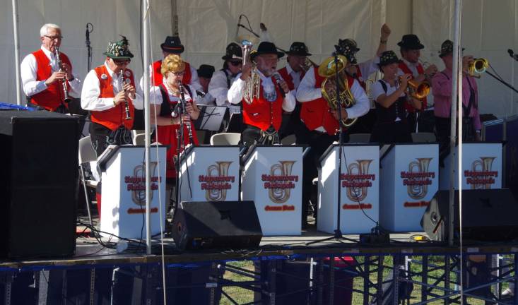 The Shippensburg Blaskapelle German Band is shown performing on the main stage during Oktoberfest at Mountain Creek Resort.
