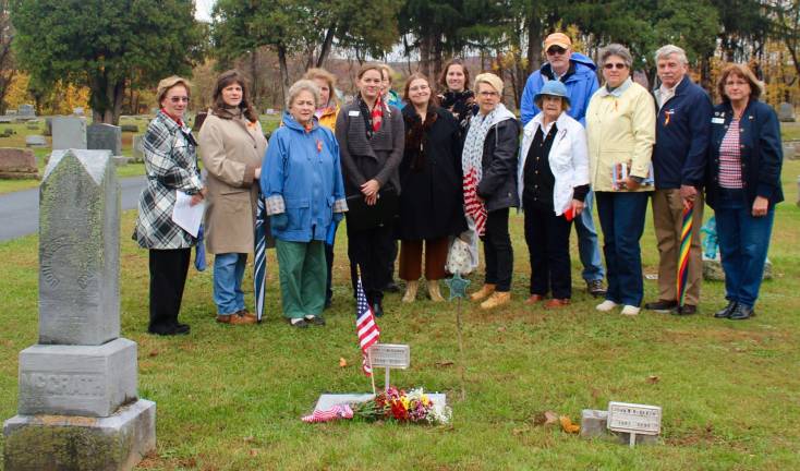 SUBMITTED PHOTO Members of the Pvt. Joseph Bessette Chapter National Society Daughters of the Union 1861- 1865 officiated the new headstone dedication ceremony and are pictured here with descendants of Civil War veteran Pvt. James McGrath.