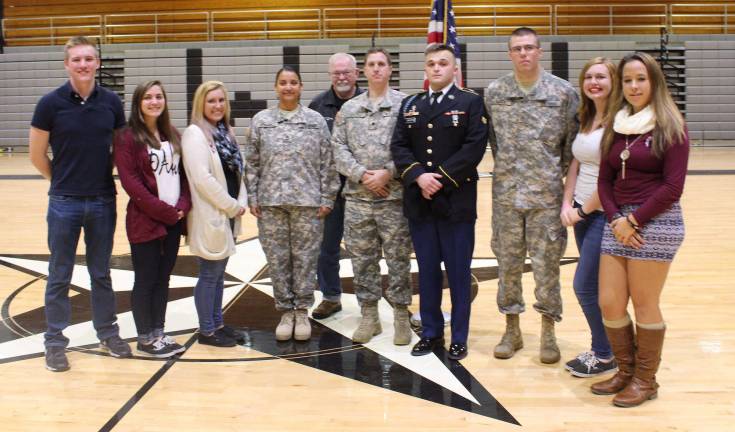 Wallkill Valley FBLA members hosted a school-wide assembly to honor local veterans on Nov. 11. Pictured from left, Scott Mueller, co-president; Destiny Van Orden, assistant chairperson; Alexa Batelli, co-president; Veterans Sabrina Sienkiewicz, Guy McHugh, Andrew Cross, John Sheldon, Keith Cusick; Ana Schroeder, committee member, and Katie Bertoa, chairperson.