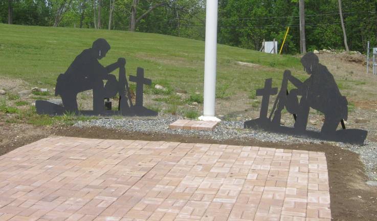 Eagle Scout candidate Devin Reilly placed pavers and memorial stones at the site.