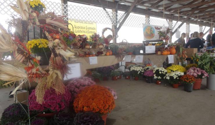 Sussex County celebrates fall with Harvest, Honey and Garlic Fest at Fairgrounds Kuperus Farmside Gardens and Florist, of Sussex, set up a fall display.