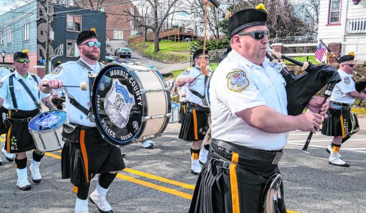 Members of the Police Pipes and Drums of Morris County play as they march in the St. Patrick’s Day Parade on Saturday, March 16 in Newton. (Photos by Nancy Madacsi)