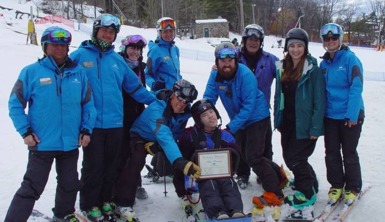 Nick Cerrato receives a Certificate of Achievement from the Adaptive Sports Program founders and Program Instructors.
