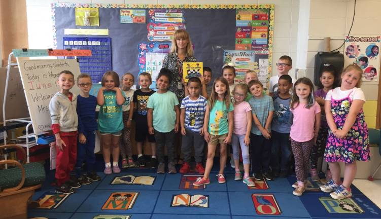 Mrs. Susan Hearn, a middle school teacher in Hamburg School is also the published author of &#x201c;Martin and T.J.&#x2019;s Race Car Repair&#x201d;. After reading the story to Ms. Tara Scrittore&#x2019;s kindergarten class Mrs. Hearn donated a signed copy of the book to their classroom.