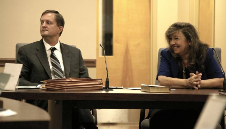 Not guilty Photos by CHris Wyman Susan Kehoe smiles as she acknowledges about ten of her supporters. Sitting with her is her attorney Daniel Perez.