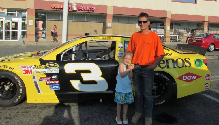 Tim Clark and daughter, Jessica Clark, of Andover are shown with the race car.