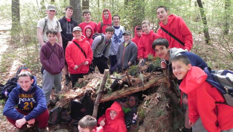 Troop 90 students built a shelter in the woods at a camporee.