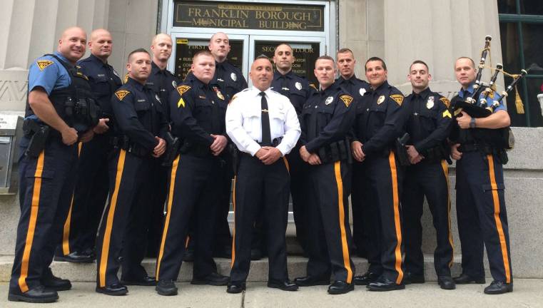 Photo by Diana Goovaerts Officers of the Franklin Police Department are shown. Chief Eugene McInerney is in white and David Macuesten is in the top row, second from left.
