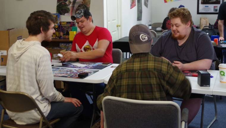 Children’s Reading Awareness Month includes free comic books Players start a round of Yu-Gi-Oh in the game room at BobþÄôs Collectables in Hardyston.
