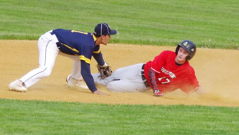In the fifth inning High Point runner Derek Sarapuchiello slides safe onto second base and beats the tag by Vernon infielder Jacob Rodriguez. Vernon Township High School defeated High Point Regional High School in varsity baseball on Friday, May 12, 2017. The final score was 3-2. High Point Regional High School in Wantage Township, New Jersey hosted the game.