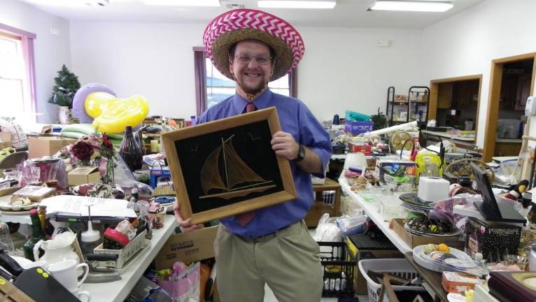Beemerville Church sale is today Pastor Barry models a sombrero that’s for sale.
