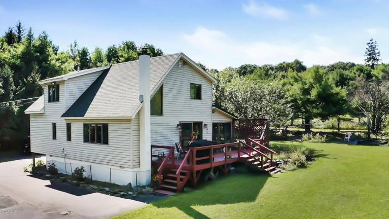 Secluded farmhouse on four acres comes with a green business