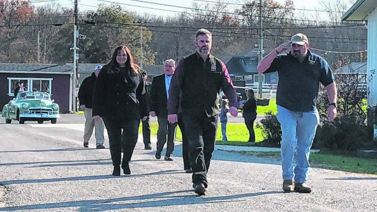 Sussex County Commissioner William Hayden, right, marches with other officials in the county’s 23rd annual Salute to Military Veterans on Nov. 5 at the Sussex County Fairgrounds. (File photo by Kathy Shwiff)