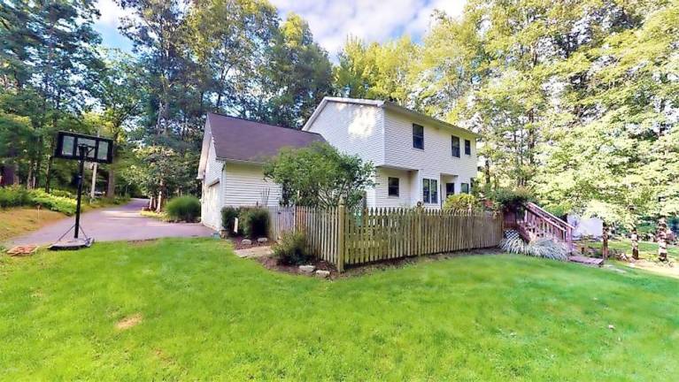 Three-bedroom colonial has large private yard and more