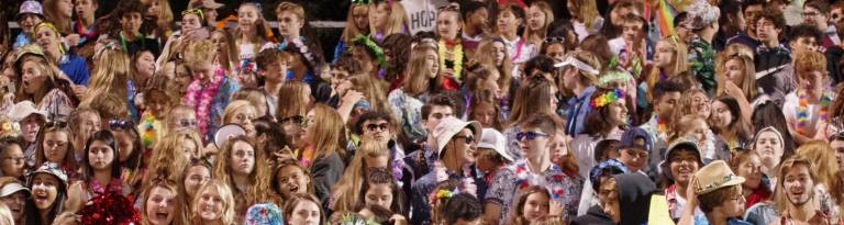 Newton Braves football fans dressed in tropical beach themed clothing.