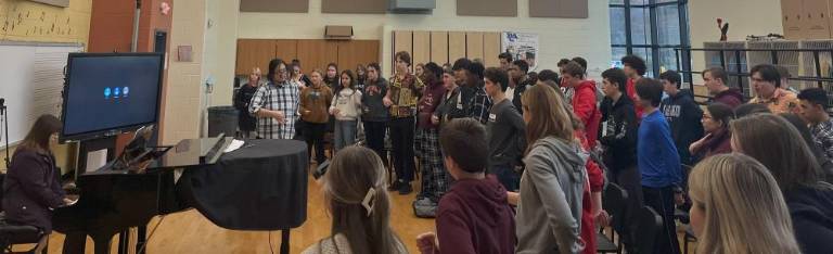 All-Sussex County band, chorus to perform tonight Director Matthew Chi Lee works with the Sussex County Chorus in the Sparta High School chorus room. (Photo provided)