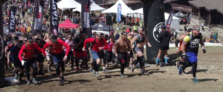 Heading up the mountain is one of the last groups of starters at the Spartan Race held on Saturday at Mountain Creek South.