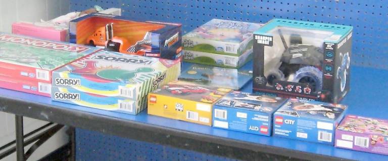New toys and games are being donated and stored at the Prince of Peace Church in Hamburg. (Photo by Janet Redyke)