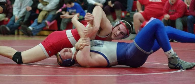 High Point's Kevin Lewis and Kittatinny's Luke DeGroat grab each other in the 195-pound weight class.