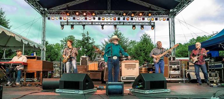 The Charlie Daniels Band plays on stage.