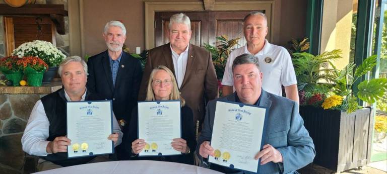 A Joint Legislative Resolution recognized Crystal Springs Resort of Hamburg its sustainability initiatives. Seated, from left, are Andrew Mulvihill, president of Crystal Springs Builders; Julie Mulvihill, chief executive of Crystal Springs Resort; and Chris Mulvihill, chief marketing officer of Crystal Springs Resort. Standing, from left, are Kevin Rooney, state Sen. Steve Oroho and Assemblyman Hal Wirths. (Photo provided)