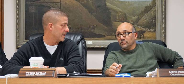 PHOTOS BY VERA OLINSKI From left, Council President Peter Opilla and Councilman David Astor discuss borough health insurance.