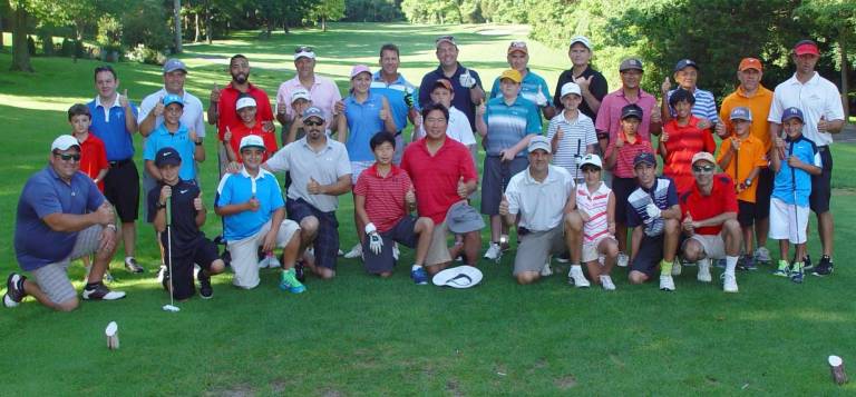 The parent/junior golfers give a &quot;thumbs up&quot; to the Mid-Summer Golf Classic at Minerals Golf Club, Vernon, NJ