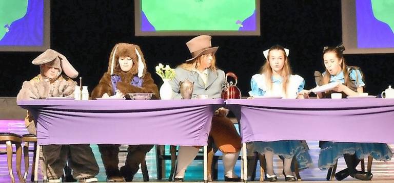 Whacky characters abound in Kittatinny Players’ ‘Alice in Wonderland’ At the tea party with the March Hare (Camryn Ricard), the Dormouse (Sofia Bodnar), and the Mad Hatter (Sarah Inglima).(Photo provided)