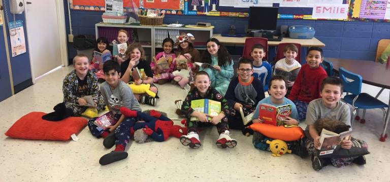 To celebrate the Love of Reading Week, the students in Mrs. Lisa Colyer and Miss Rachel Windish's third grade class took some time out of their busy school day to relax and read while wearing their pajamas.