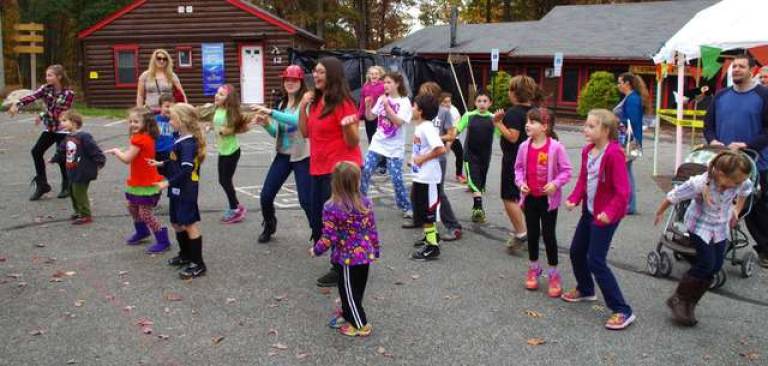 Oak Ridge DJ Earl Heller of Sound Solutions Entertainment got the kids dancing with a game of Head, Shoulders, Knees and Toes.