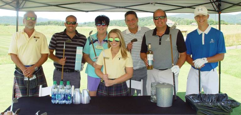 Ballyowen Ranger Joe, Christine and golfers enjoy some Macallan Scotch prior to teeing off on the 4th hole using hickory golf clubs.