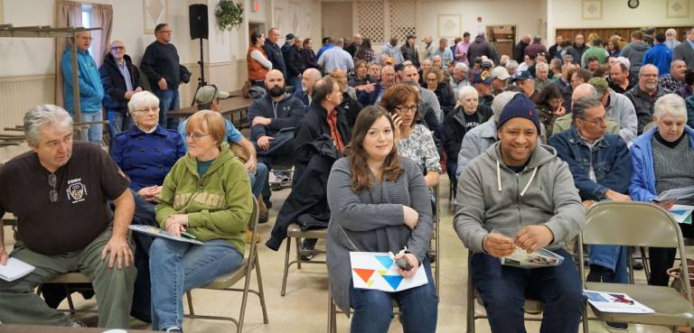 PHOTO BY VERA OLINSKI Ogdensburg residents wait for the Elizabethtown Gas Town Hall meeting to begin.