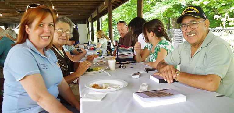 PHOTOS BY CHRIS WYMAN. Assemblywoman Alison McHose shares a meal with Vietnam-era Air Force veteran Joe Mora of Ogdensburg during the Sussex County Veterans&#xed; Picnic at the American Legion Post in Wantage.