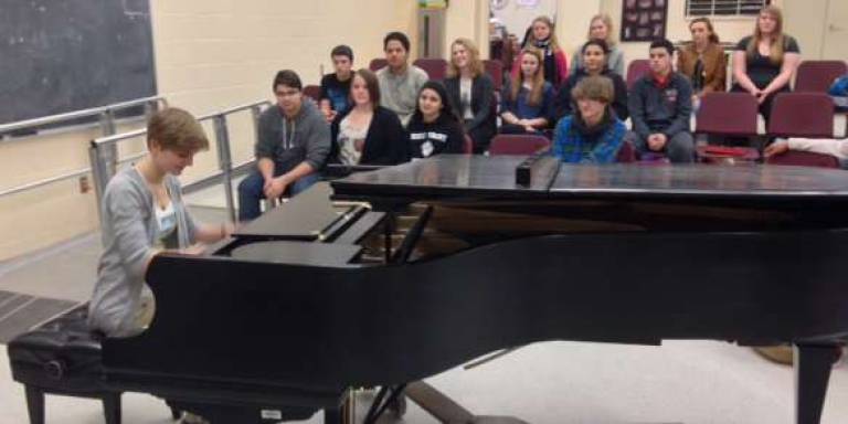 Becky Turro, left, is shown playing the piano at High Point Regional High School.