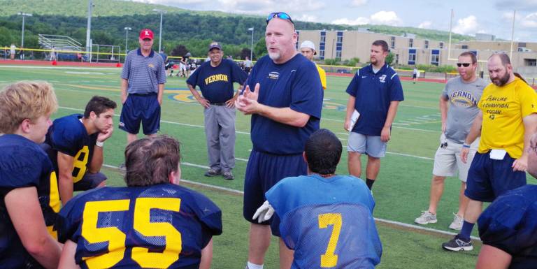 Vernon Township High School varsity football coach Chuck Tepper speaks to the Vikings.