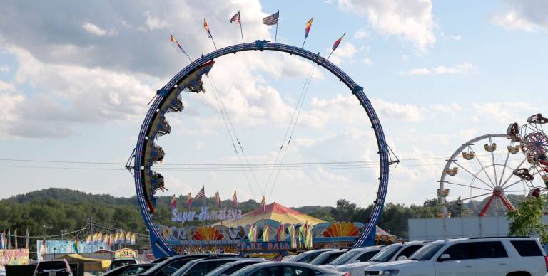 Rides are shown from the parking lot at the New Jersey State Fair.
