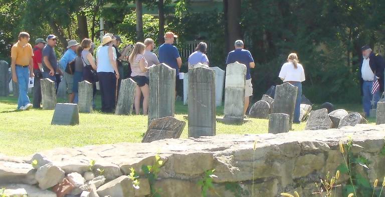 The noon tour gathers around “cemetery inhabitant” George Griggs played by Wayne McCabe