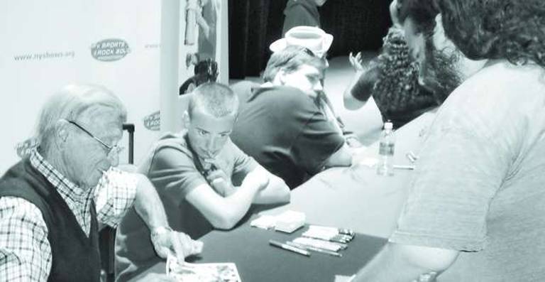 1952 MVP and 1958 Yankees World Series Champion Bobby Shantz signs an autograph at the Westchester County Center for Joshua Fruchtman.