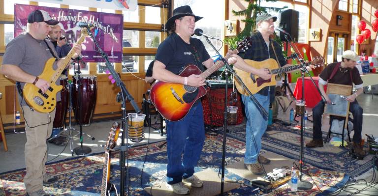 Chili Open draws 120 Golfers to fairgrounds The band R.E.N.O. volunteered their musical talents.
