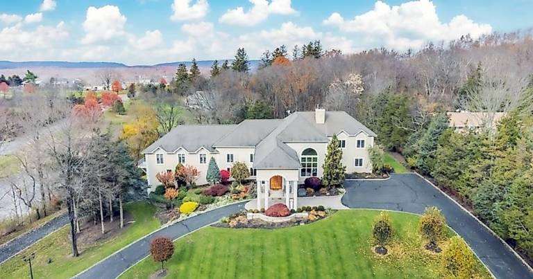 Custom estate includes car charging station, hot yoga room, and frescos Custom estate includes car charging station, hot yoga room, and frescos