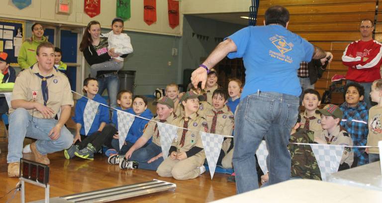 Scout Leader Carlos Soares gets the scouts excited as the next race begins.