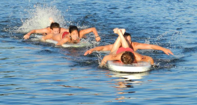 Lake Mohawk Pool catching up to LMCC in the Paddle Board Relay