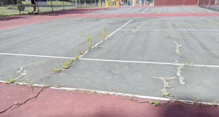 Merriam tennis court is playable once again The Merriam tennis court before repairs (Mary Rapuano)