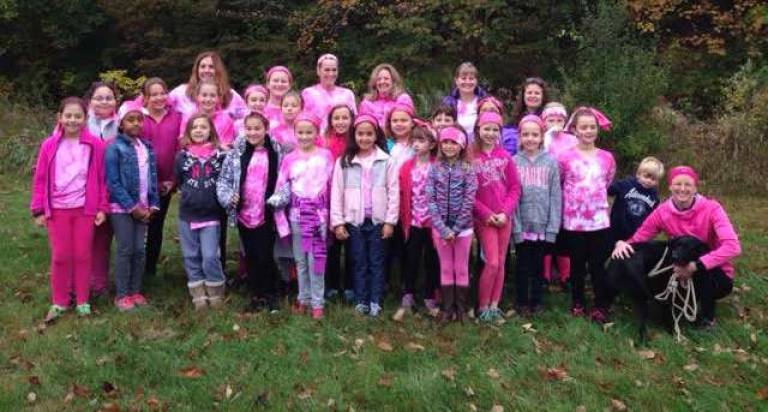 The two Girls on the Run teams from Hardyston came out in full pink to volunteer their time to pass out water and cheer on the runners at the Hot Chilli Challenge, a race that raises money for breast cancer research.
