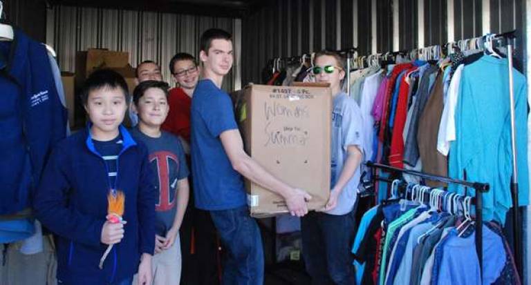 Boy Scout Troop 912 from Vernon helping with the clothing for veterans at Moove In storage in Hampton.